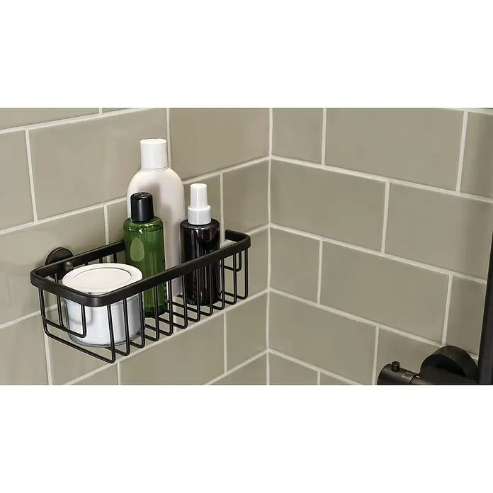 tesa Moon Duschablage schwarz montiert in der Dusche mit Shampoo und Pflegeprodukten